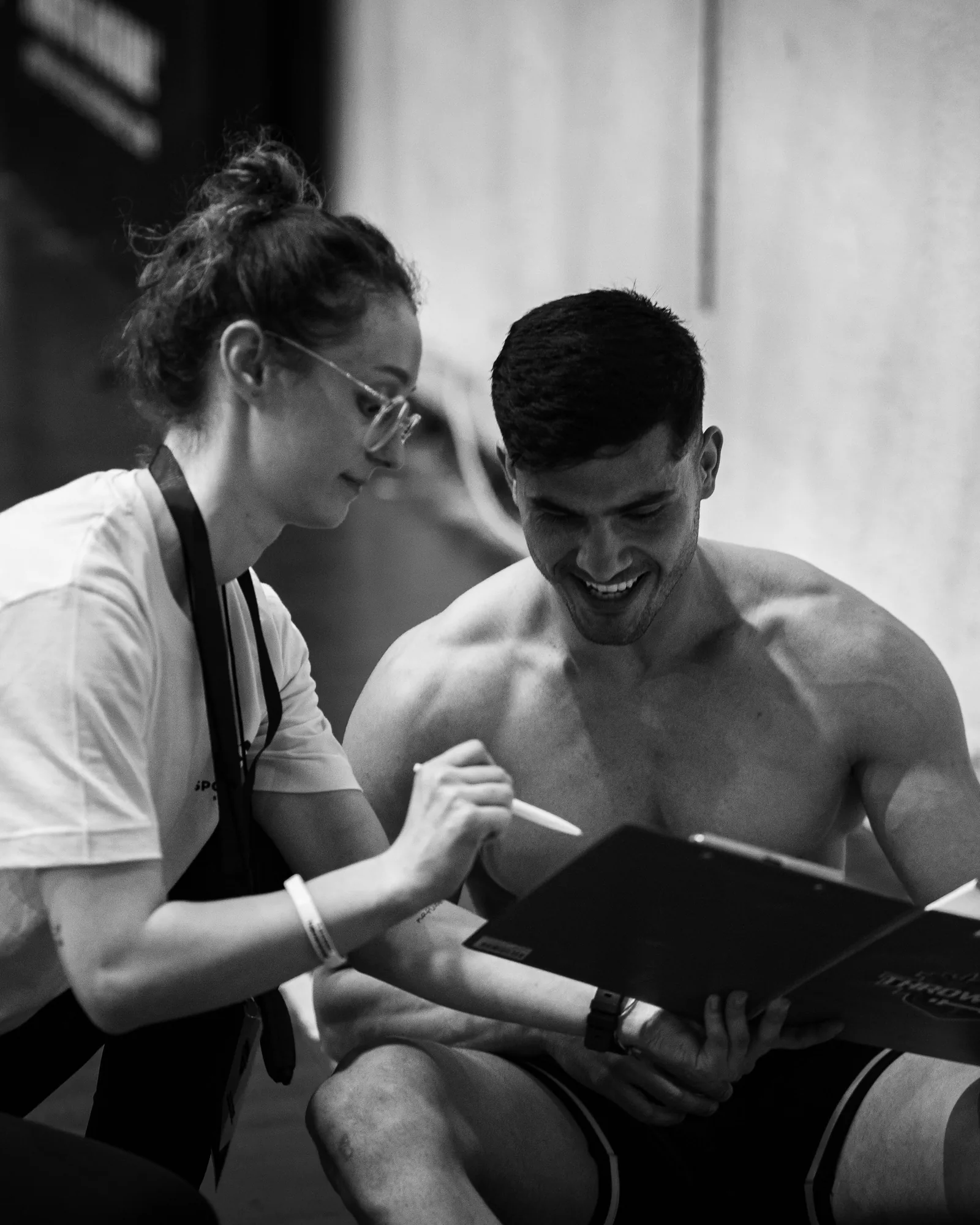 Coach discussing training goals and performance plan with athlete