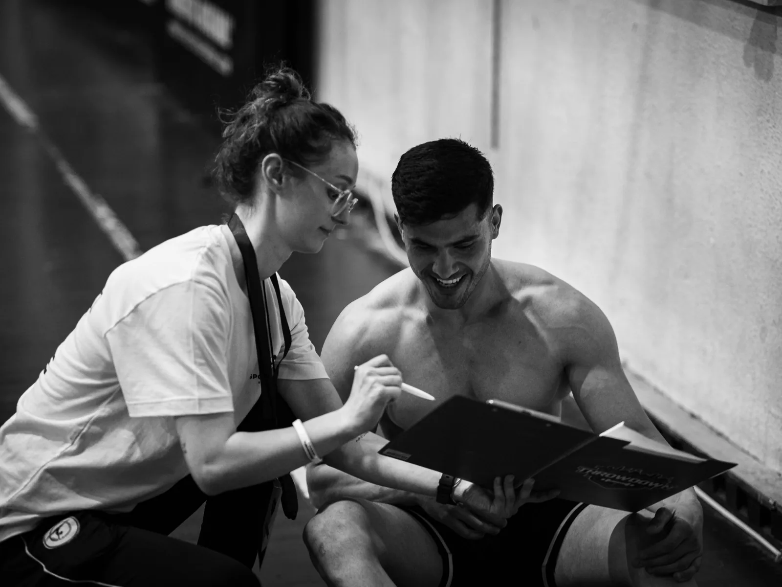 Coach discussing training goals with an athlete