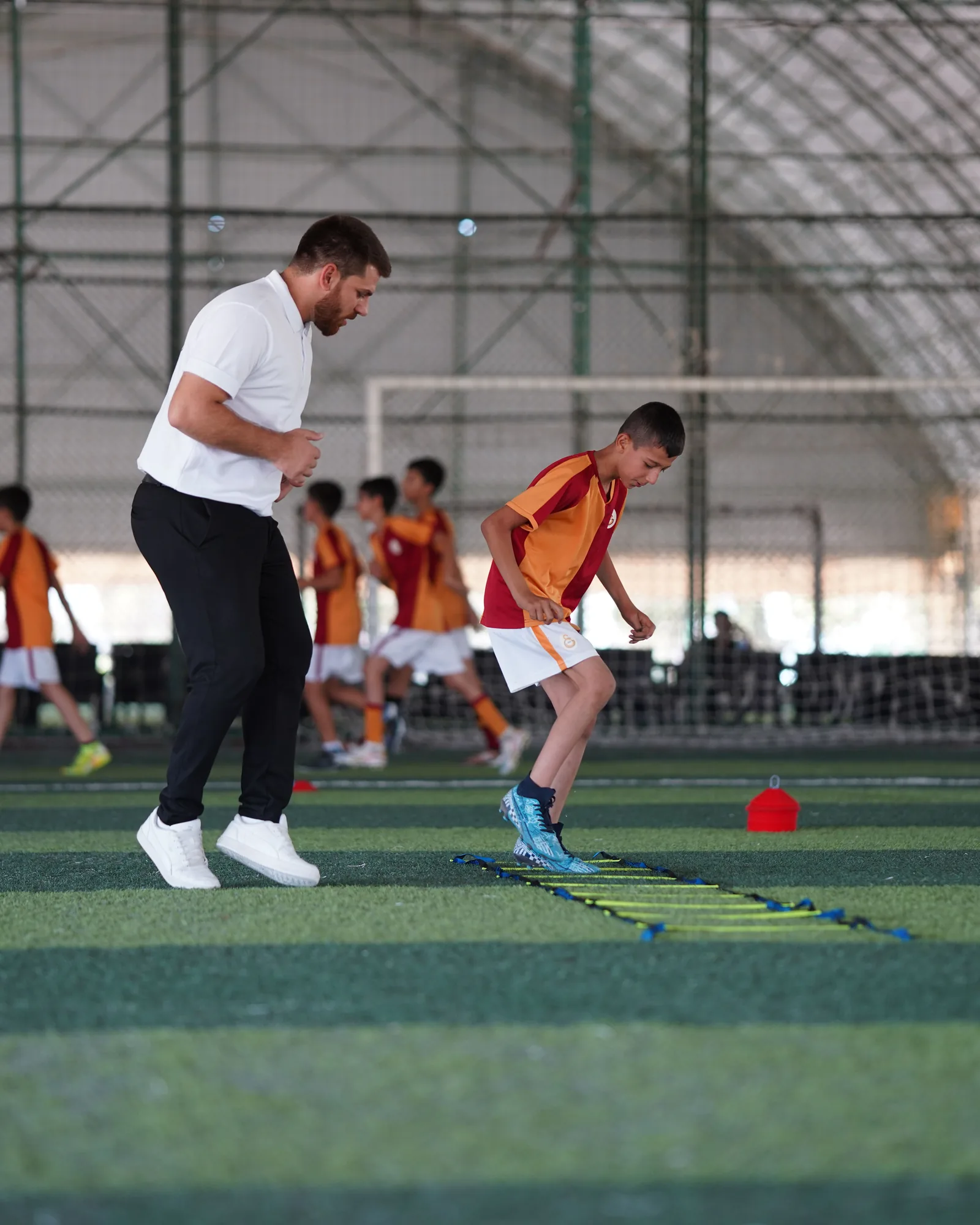 Individual football player receiving performance coaching
