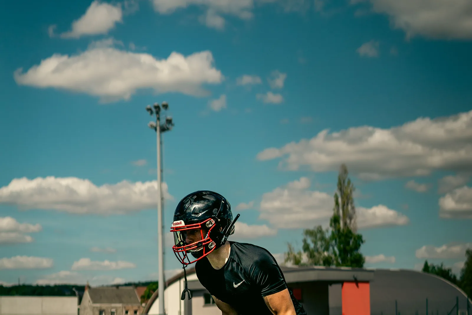Football player completing physical performance training